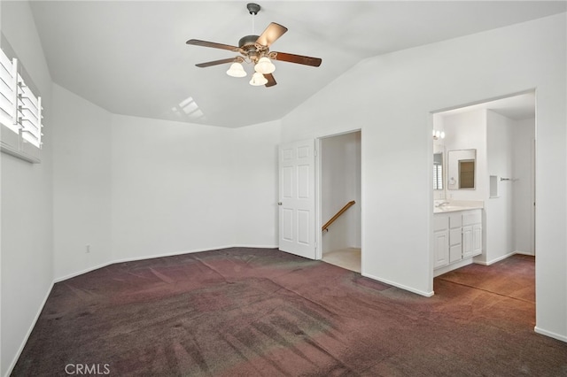 39312 Via Belleza, Murrieta, CA 92563 - unfurnished bedroom featuring carpet, lofted ceiling, connected bathroom, and a ceiling fan