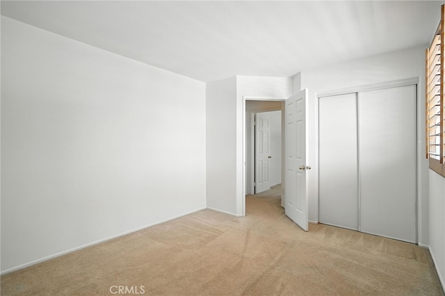 39312 Via Belleza, Murrieta, CA 92563 - unfurnished bedroom featuring light colored carpet and a closet