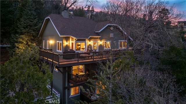 813 Brentwood Dr, Lake Arrowhead, CA 92352 - back of house with roof with shingles, a chimney, and a wooden deck