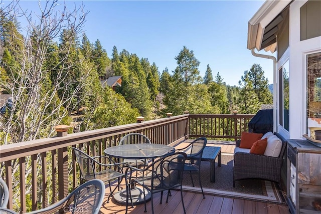 813 Brentwood Dr, Lake Arrowhead, CA 92352 - deck with outdoor dining space, an outdoor living space, and a wooded view