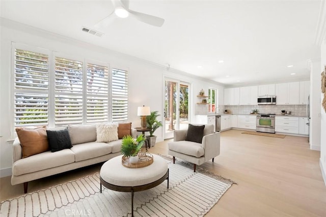 6407 Ruby, Carlsbad, CA 92011 - living room featuring light wood-style flooring, ceiling fan, recessed lighting, and crown molding