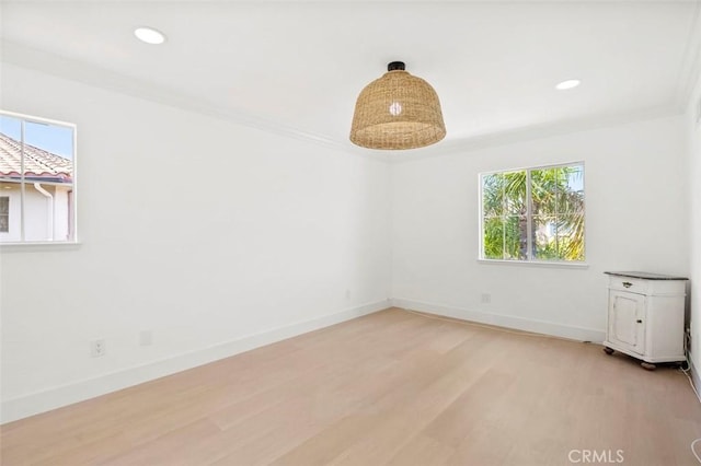 6407 Ruby, Carlsbad, CA 92011 - unfurnished room featuring healthy amount of natural light, light wood finished floors, ornamental molding, and recessed lighting