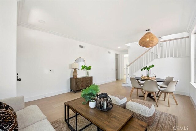 6407 Ruby, Carlsbad, CA 92011 - living area with stairway, light wood-type flooring, crown molding, and recessed lighting