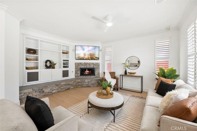 6407 Ruby, Carlsbad, CA 92011 - living room with crown molding, wood finished floors, ceiling fan, and a stone fireplace
