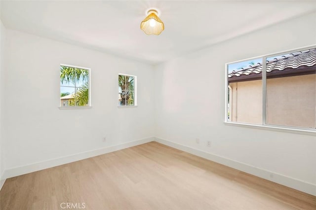 6407 Ruby, Carlsbad, CA 92011 - spare room featuring wood finished floors and baseboards