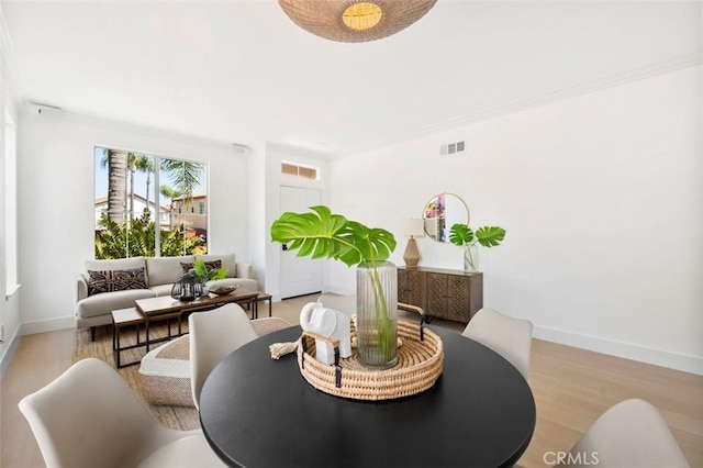 6407 Ruby, Carlsbad, CA 92011 - dining room featuring wood finished floors and ornamental molding