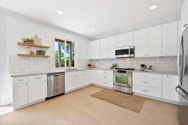6407 Ruby, Carlsbad, CA 92011 - kitchen with stainless steel appliances, light wood-style floors, light countertops, ornamental molding, and recessed lighting