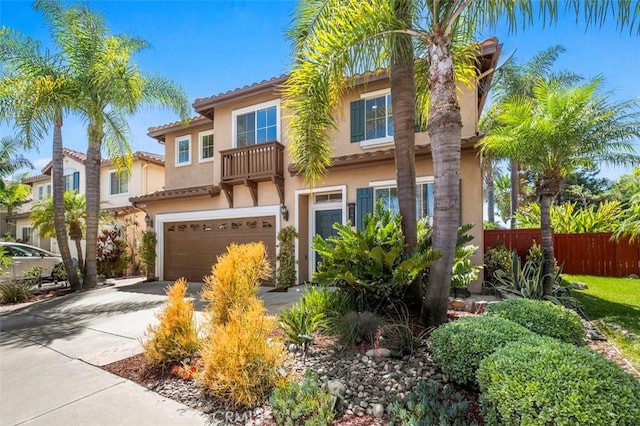 6407 Ruby, Carlsbad, CA 92011 - view of front of property featuring a garage, a balcony, stucco siding, and driveway