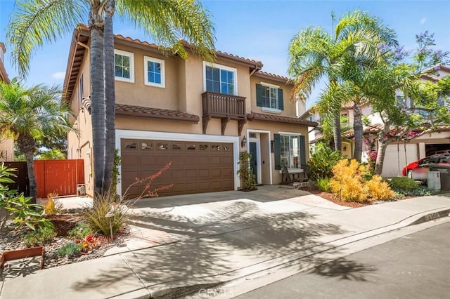 6407 Ruby, Carlsbad, CA 92011 - view of front of house featuring a tile roof, a garage, stucco siding, concrete driveway, and a balcony