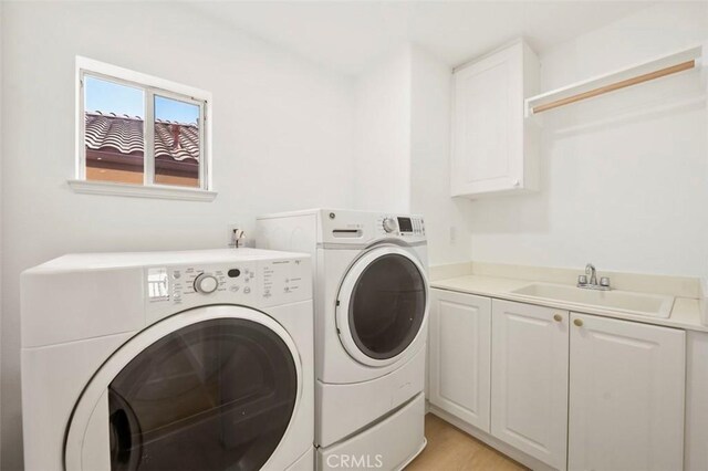 6407 Ruby, Carlsbad, CA 92011 - laundry room featuring independent washer and dryer and cabinet space