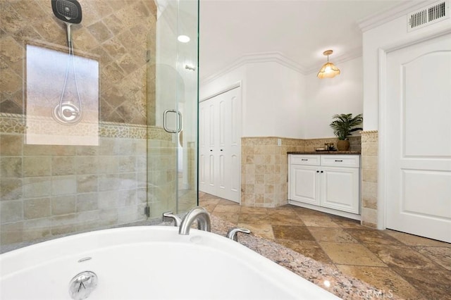 6407 Ruby, Carlsbad, CA 92011 - bathroom with tile walls, a garden tub, crown molding, vanity, and a shower stall