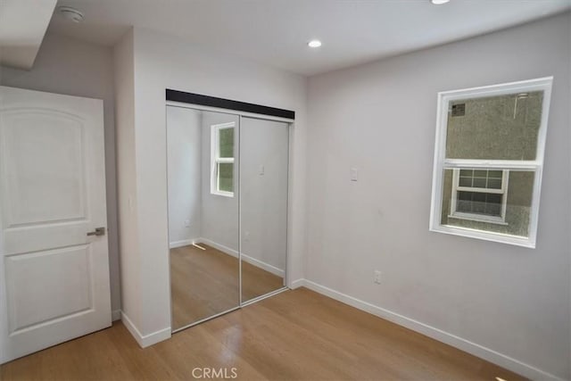 10324 Silverton Ave, Tujunga, CA 91042 - unfurnished bedroom with wood finished floors, recessed lighting, and a closet