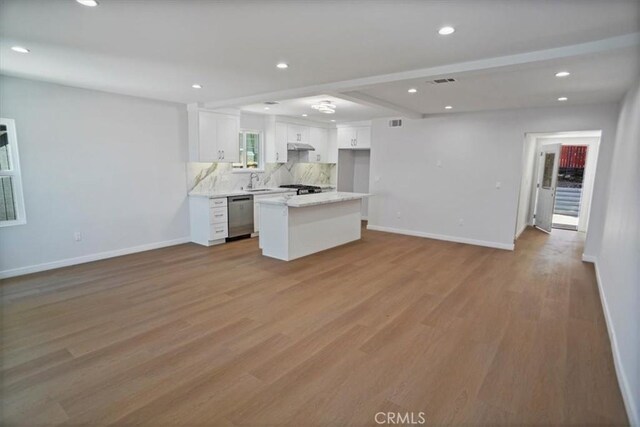 10324 Silverton Ave, Tujunga, CA 91042 - kitchen with stainless steel dishwasher, open floor plan, tasteful backsplash, white cabinetry, and recessed lighting