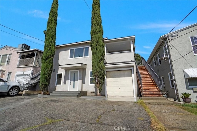 10324 Silverton Ave, Tujunga, CA 91042 - townhome / multi-family property featuring stairs, stucco siding, and a garage