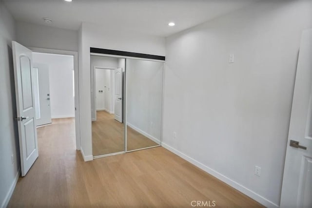 10324 Silverton Ave, Tujunga, CA 91042 - unfurnished bedroom featuring light wood finished floors, a closet, and recessed lighting