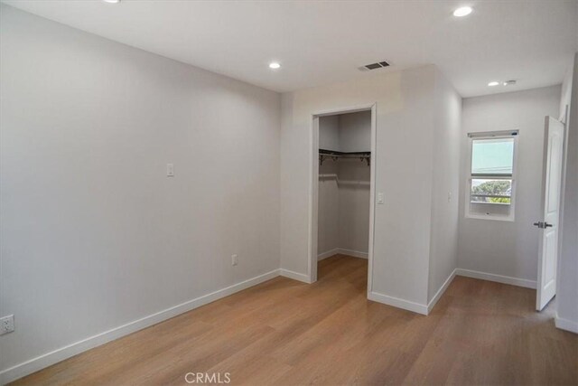 10324 Silverton Ave, Tujunga, CA 91042 - unfurnished bedroom featuring light wood-style floors, recessed lighting, a spacious closet, and a closet