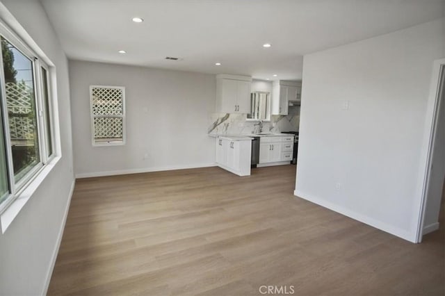 10324 Silverton Ave, Tujunga, CA 91042 - unfurnished living room with light wood-style floors and recessed lighting