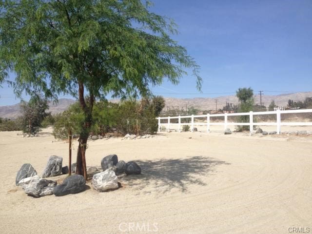 67190 Dillon Rd, Desert Hot Springs, CA 92240 - view of yard featuring a mountain view and a view of rural / pastoral area