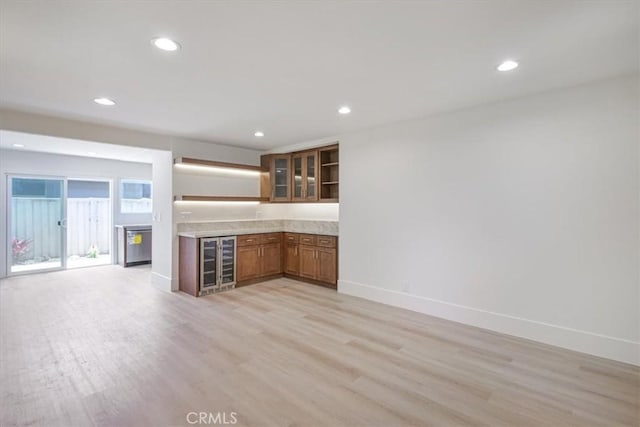 229 Springview, Irvine, CA 92620 - kitchen featuring wine cooler, open shelves, light wood-style flooring, brown cabinetry, and recessed lighting