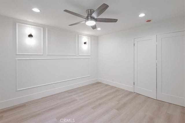 229 Springview, Irvine, CA 92620 - unfurnished bedroom with recessed lighting, light wood-type flooring, a ceiling fan, and a decorative wall