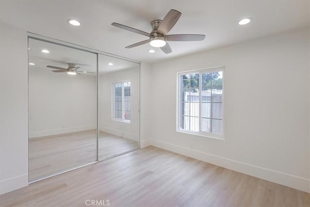 229 Springview, Irvine, CA 92620 - unfurnished bedroom with wood finished floors, a closet, recessed lighting, and a ceiling fan
