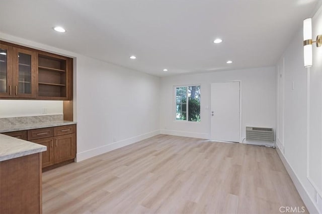 229 Springview, Irvine, CA 92620 - unfurnished living room with light wood-style flooring, recessed lighting, and a wall unit AC