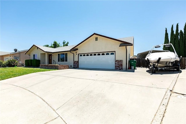 1019 W Monterey St, Orland, CA 95963 - single story home with a garage, concrete driveway, and stucco siding