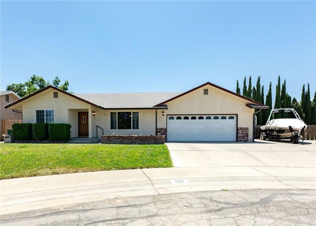 1019 W Monterey St, Orland, CA 95963 - single story home featuring an attached garage, stucco siding, concrete driveway, and brick siding