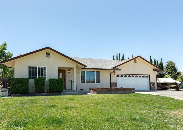 1019 W Monterey St, Orland, CA 95963 - ranch-style house featuring a garage, driveway, and stucco siding