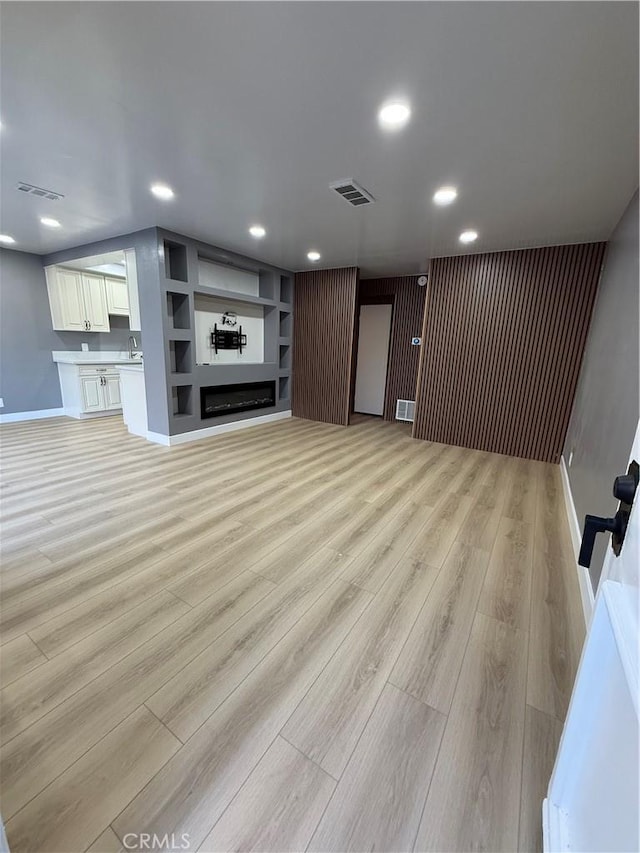 1804 Ewing Ct, Hacienda Heights, CA 91745 - unfurnished living room with light wood-style flooring and recessed lighting