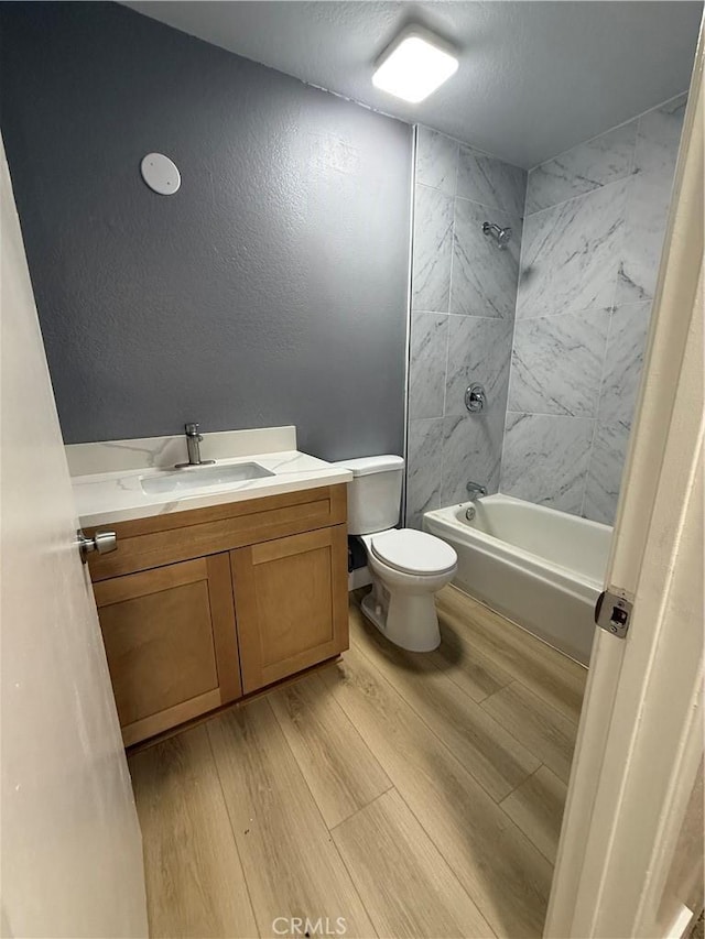 1804 Ewing Ct, Hacienda Heights, CA 91745 - full bath with wood finished floors, vanity, and washtub / shower combination
