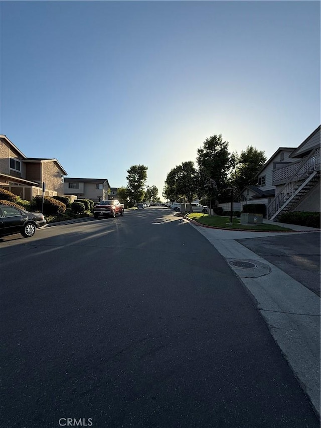 1804 Ewing Ct, Hacienda Heights, CA 91745 - view of asphalt road featuring a residential view and curbs