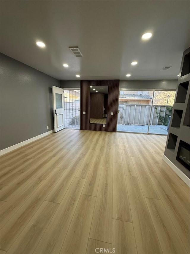 1804 Ewing Ct, Hacienda Heights, CA 91745 - unfurnished living room with light wood-type flooring, recessed lighting, and plenty of natural light