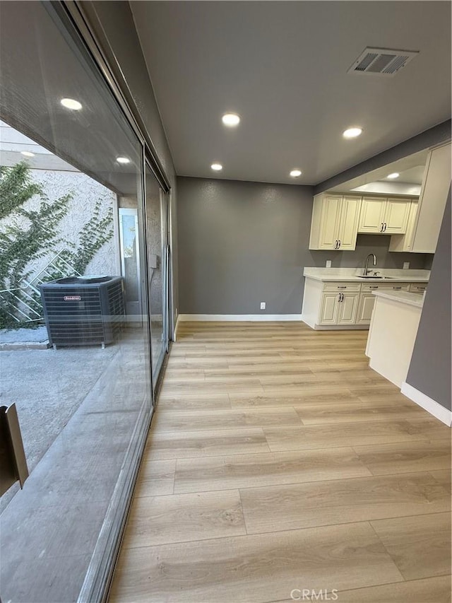 1804 Ewing Ct, Hacienda Heights, CA 91745 - kitchen featuring recessed lighting, light wood-style floors, and light countertops