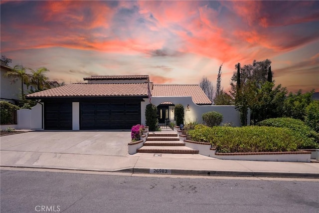 26982 Pueblonuevo Dr, Mission Viejo, CA 92691 - mediterranean / spanish home with a tiled roof, a garage, and concrete driveway