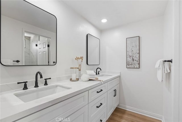 26982 Pueblonuevo Dr, Mission Viejo, CA 92691 - full bath with double vanity, wood finished floors, a shower, and recessed lighting