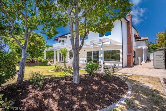 26982 Pueblonuevo Dr, Mission Viejo, CA 92691 - back of house with a pergola, a patio, a balcony, and stucco siding