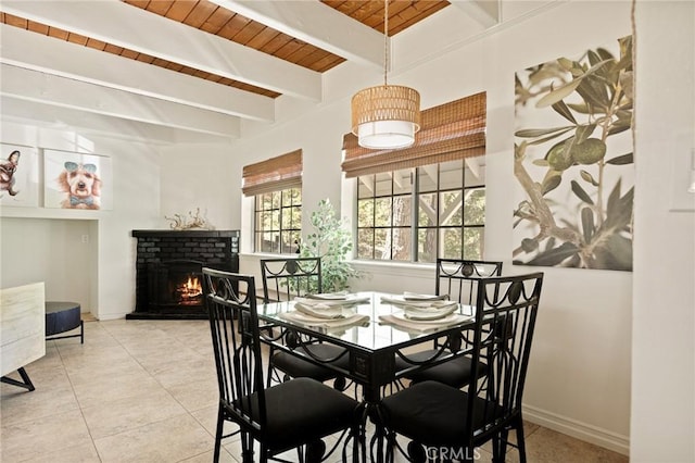 531 Rose Ln, Twin Peaks, CA 92391 - tiled dining space featuring a brick fireplace and a wooden ceiling with exposed beams
