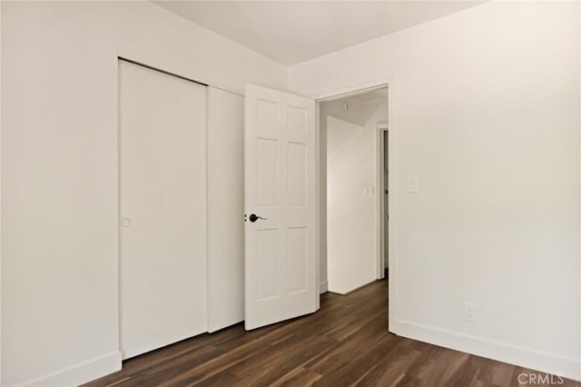 531 Rose Ln, Twin Peaks, CA 92391 - unfurnished bedroom with dark wood finished floors and a closet
