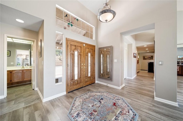 11056 Orchard View Ln, Riverside, CA 92503 - foyer featuring wood finished floors and a towering ceiling