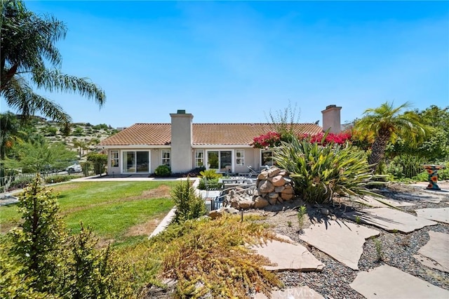 11056 Orchard View Ln, Riverside, CA 92503 - rear view of house with a chimney, a tile roof, a patio, and stucco siding