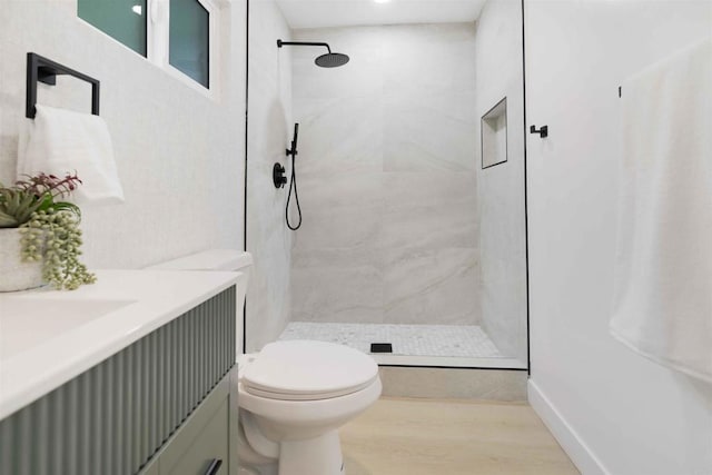 254 Rexview Dr, San Diego, CA 92114 - bathroom with a tile shower, vanity, and wood finished floors