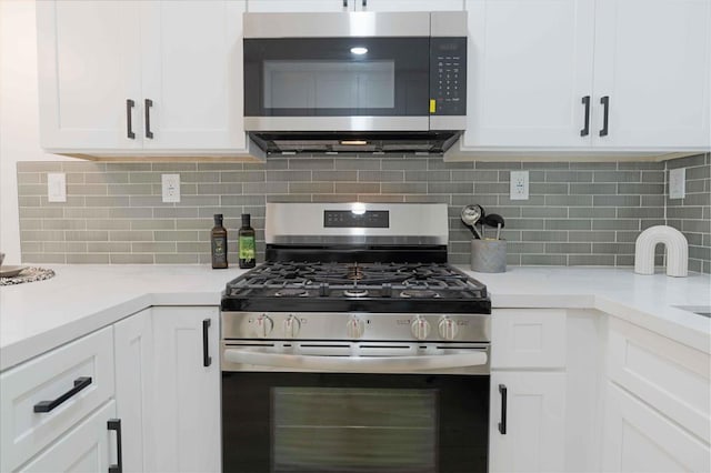 254 Rexview Dr, San Diego, CA 92114 - kitchen with stainless steel appliances, white cabinets, light countertops, and decorative backsplash