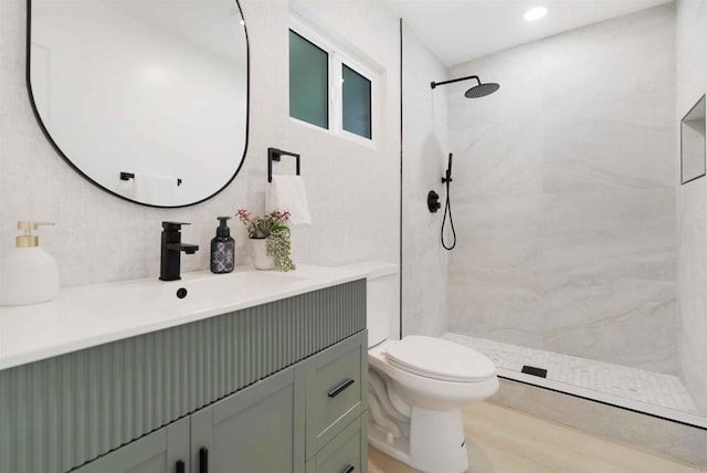 254 Rexview Dr, San Diego, CA 92114 - full bath with vanity, tiled shower, wood finished floors, and backsplash