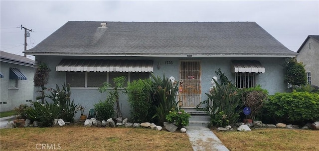 1726 E 122nd St, Los Angeles, CA 90059 - bungalow featuring stucco siding and a shingled roof