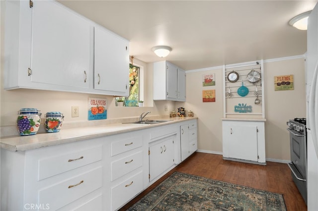 6435 Norwood Ave, Riverside, CA 92505 - kitchen with stainless steel gas range oven, dark wood-style floors, and white cabinetry