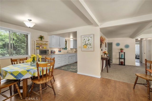 6435 Norwood Ave, Riverside, CA 92505 - dining space featuring beamed ceiling and light wood finished floors