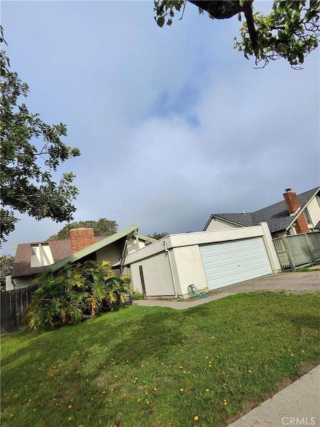1235 Callas Dr, Oxnard, CA 93035 - view of home's exterior featuring a garage and stucco siding