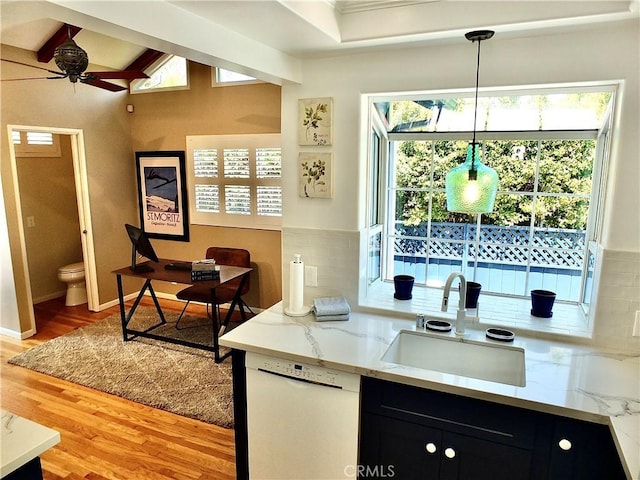 4719 E E Colorado St, Long Beach, CA 90814 - kitchen featuring white dishwasher, dark cabinets, light wood-type flooring, ceiling fan, and decorative backsplash