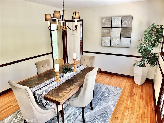 4719 E E Colorado St, Long Beach, CA 90814 - dining area with a chandelier and wood finished floors